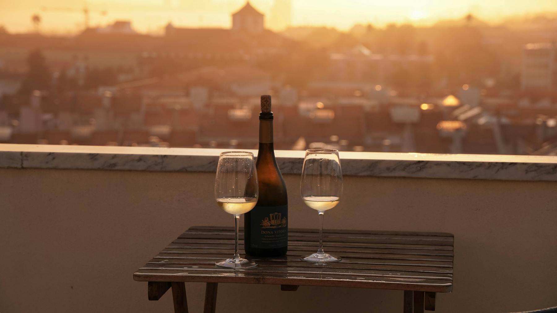 Wine on the roof at sunset