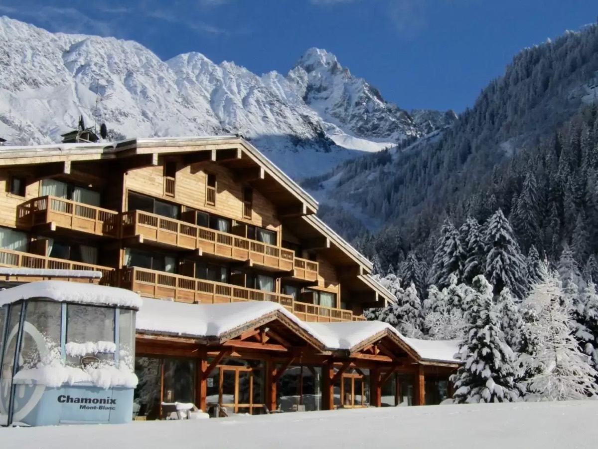 The chalet below the peaks on a clear day
